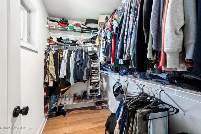 a view of a closet with storage