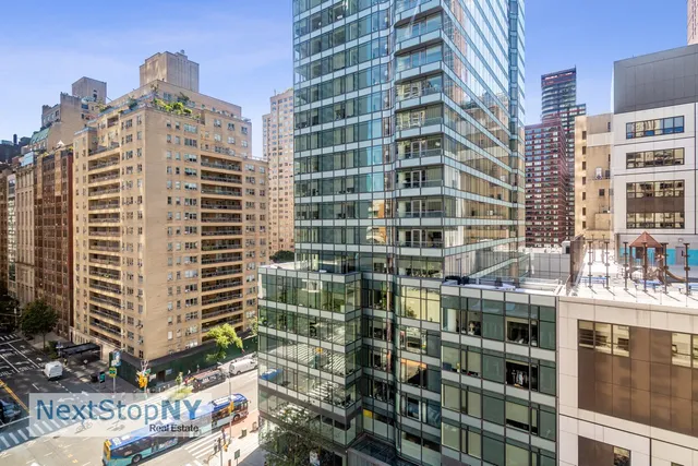 a view of a kitchen with stove and cabinets