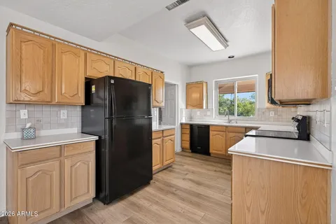 a kitchen with a sink stove and microwave