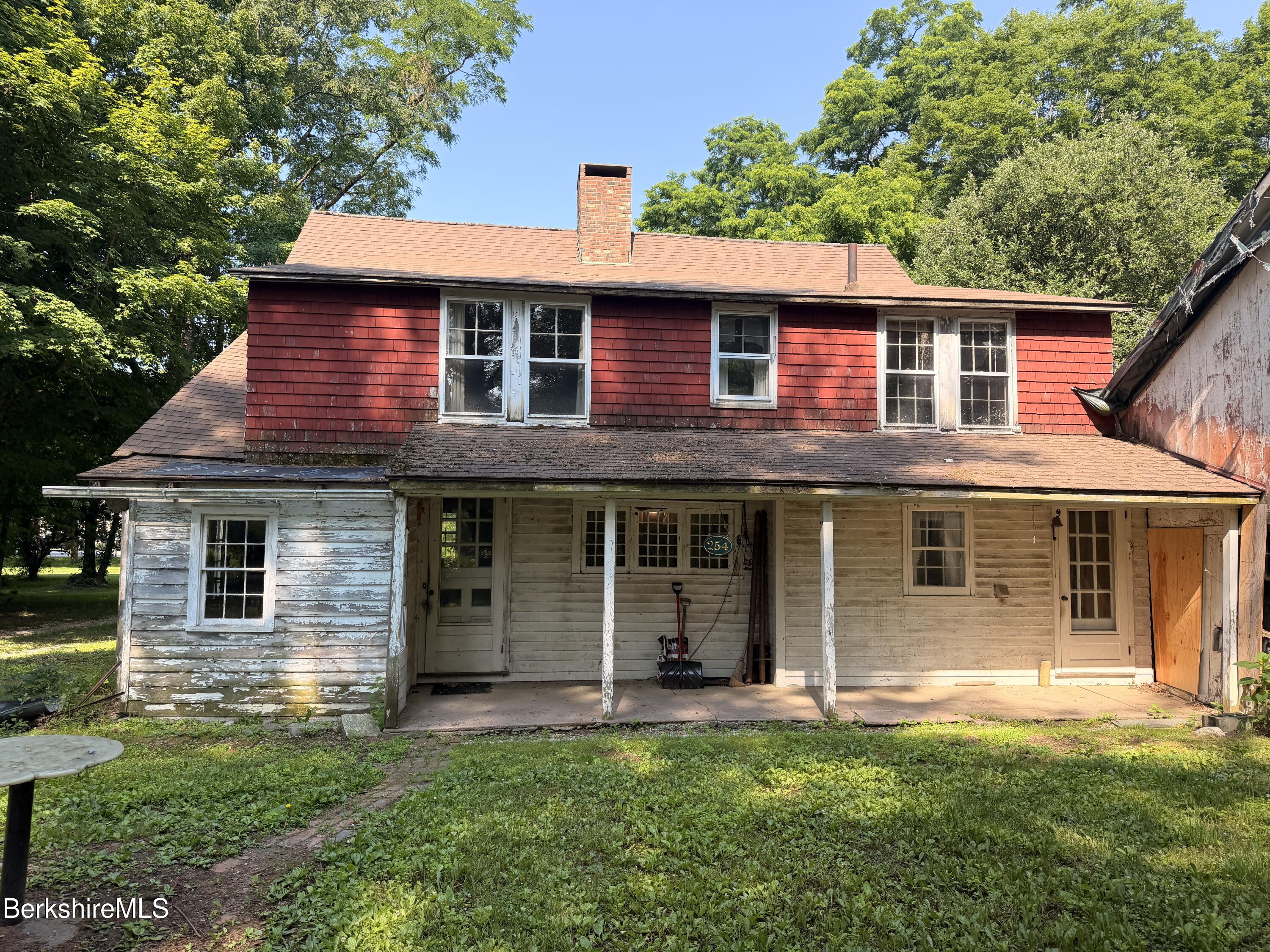 254 Main Street Sheffield, MA 01257 - Photo 3 of 13 a front view of a house with a garden