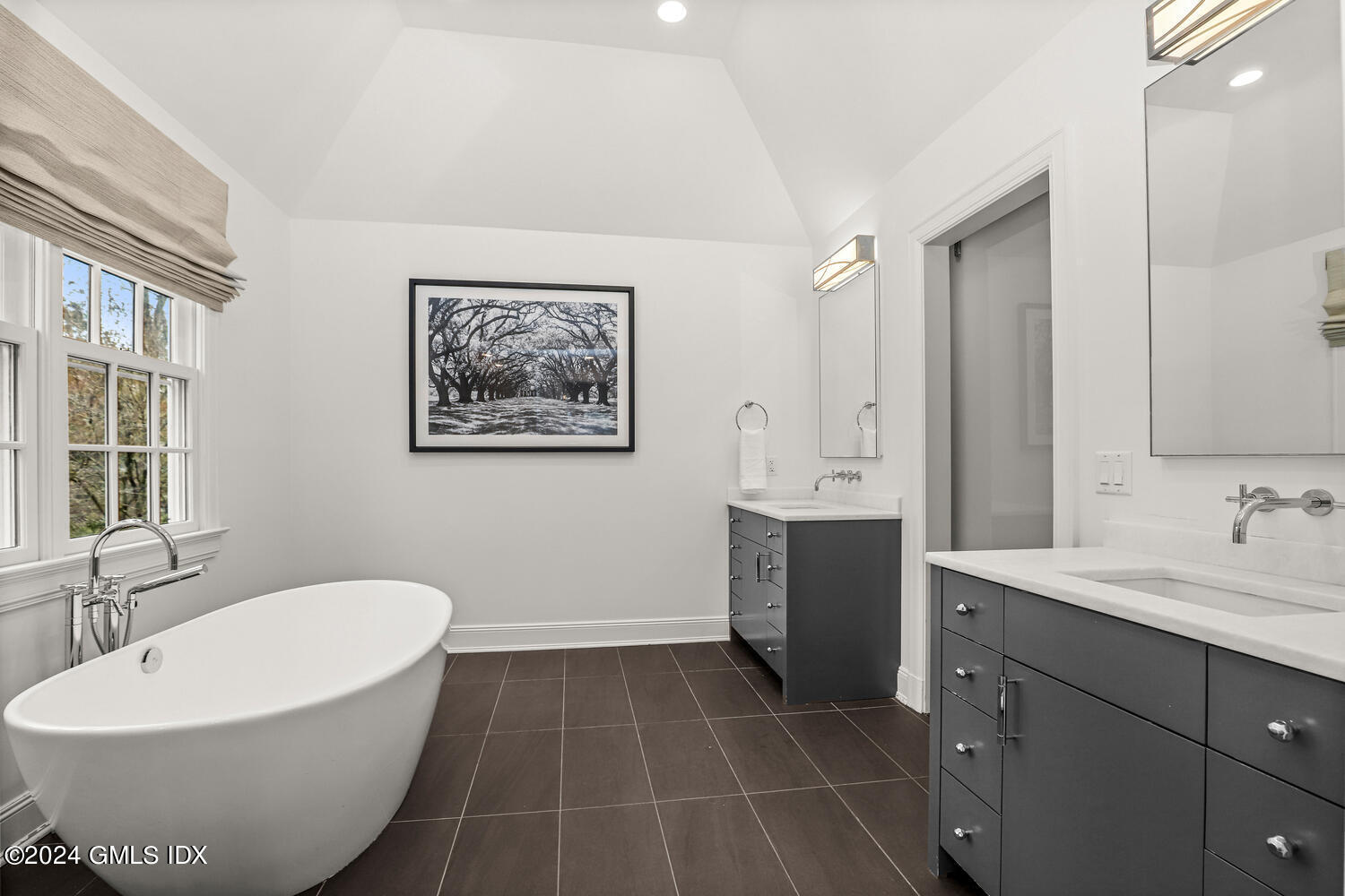 2 Lauder Way Greenwich, CT 06830 - Photo 11 of 25 a spacious bathroom with a double vanity sink a mirror and a bathtub