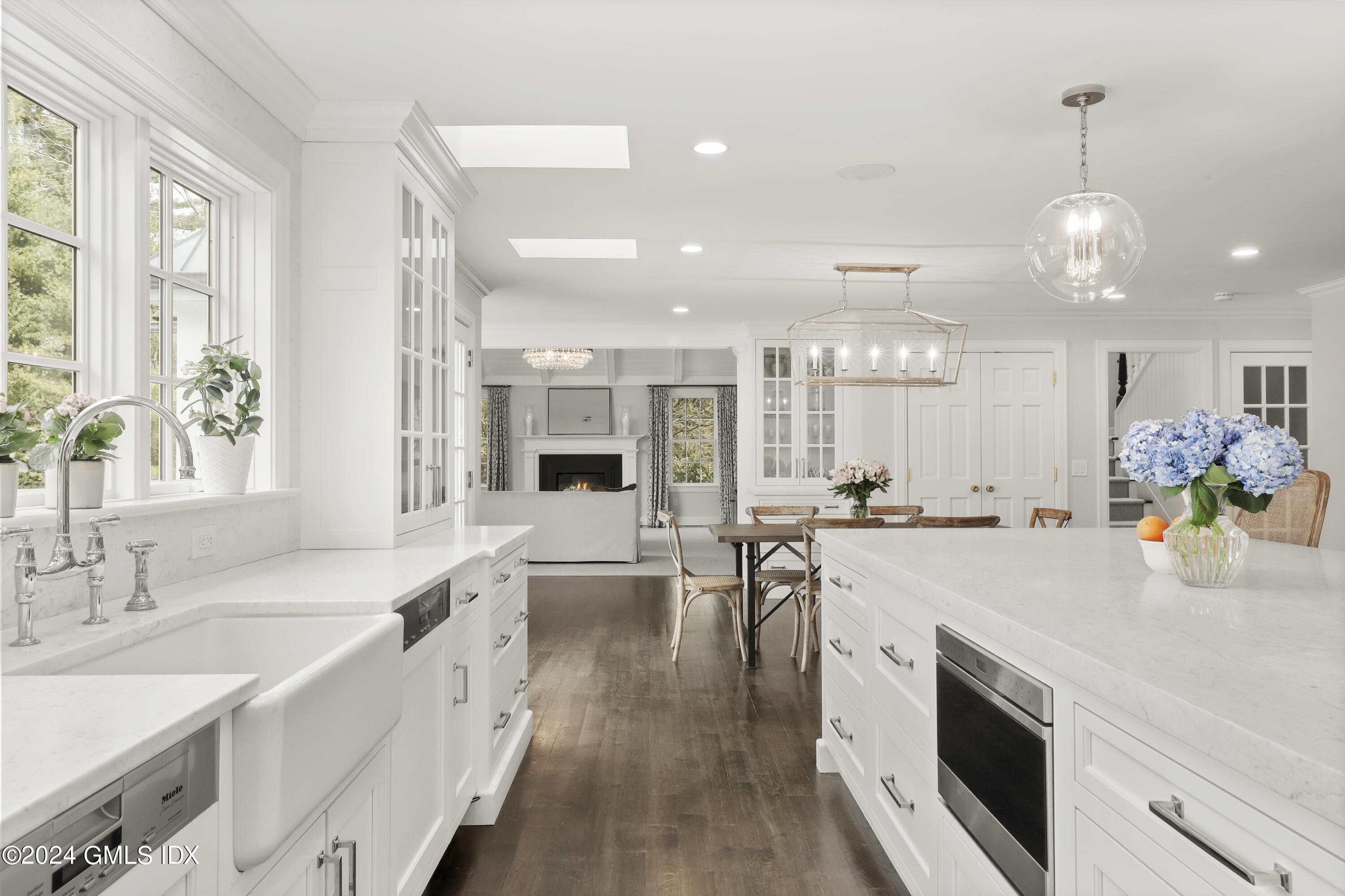 2 Lauder Way Greenwich, CT 06830 - Photo 7 of 25 a large kitchen with kitchen island a large counter space a sink stainless steel appliances and cabinets