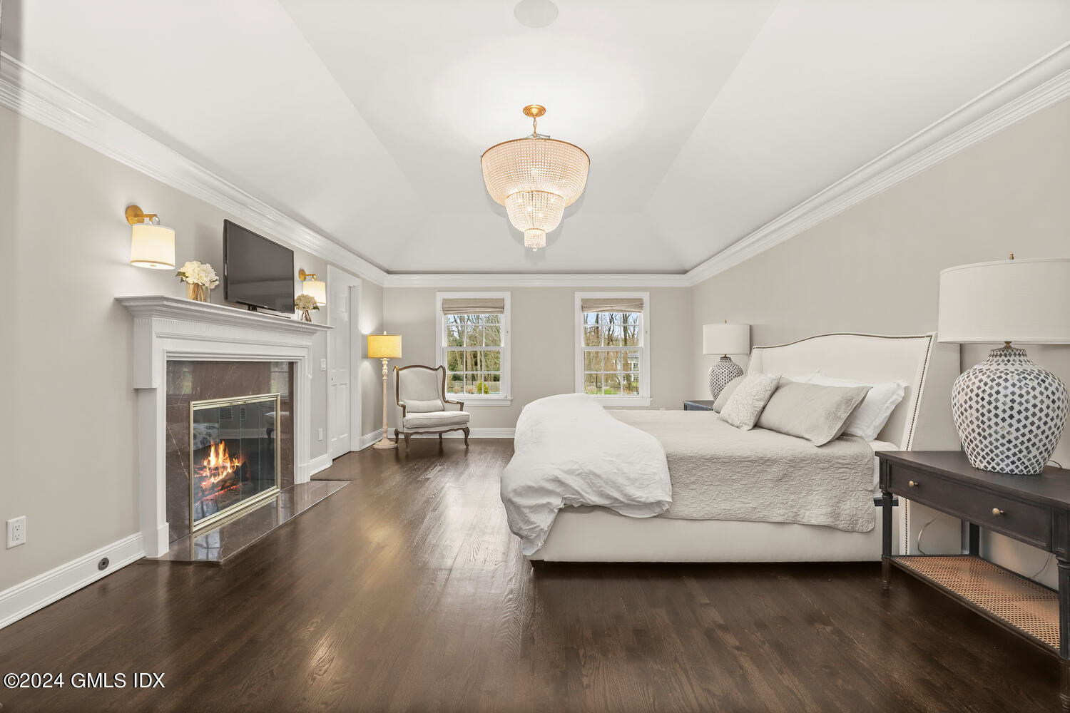 2 Lauder Way Greenwich, CT 06830 - Photo 10 of 25 a spacious bedroom with a bed and a fireplace