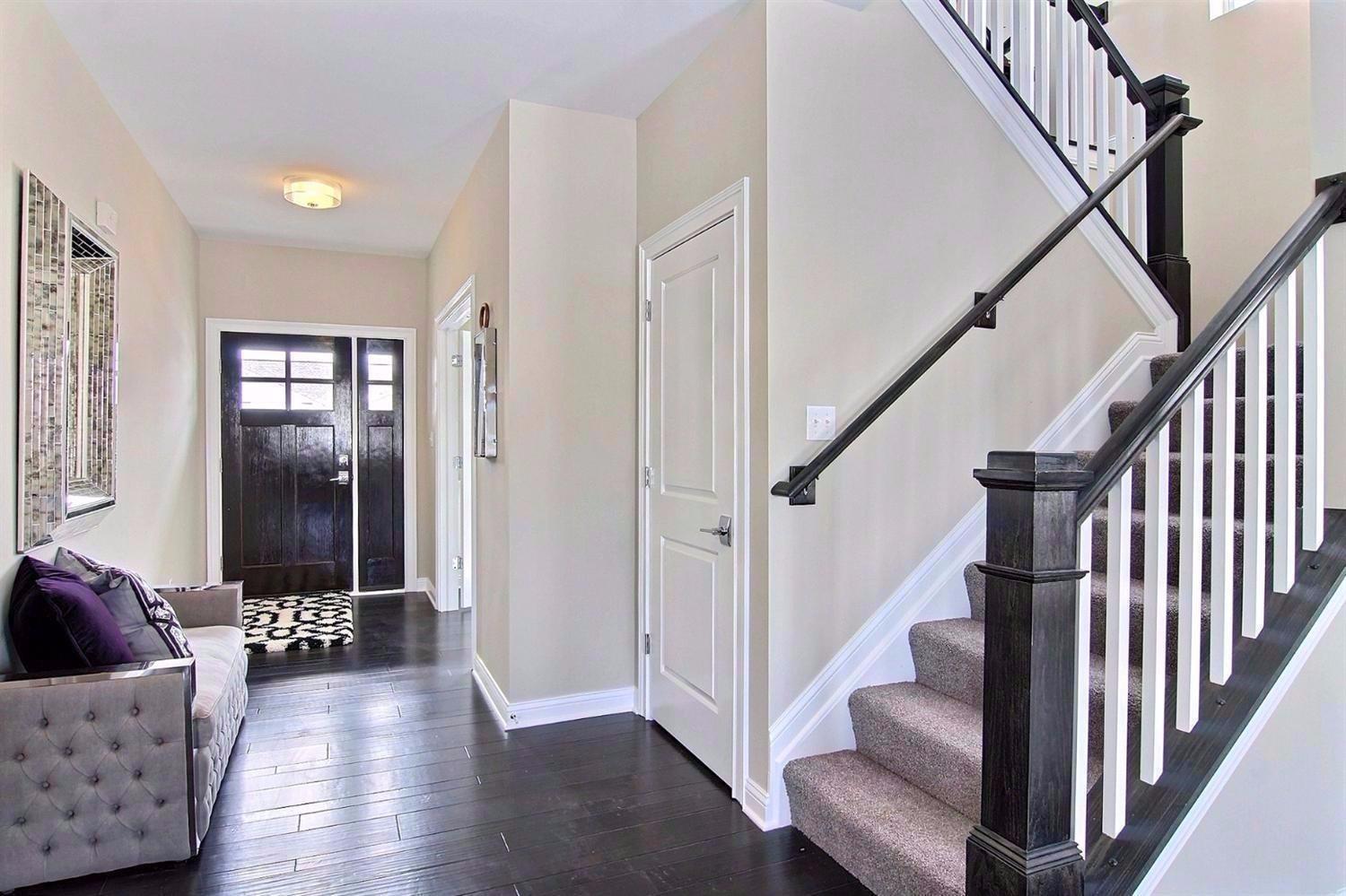 5833 Burr Rdg Circle Crown Point, IN 46307 - Photo 2 of 19 a view of a hallway with wooden floor and staircase