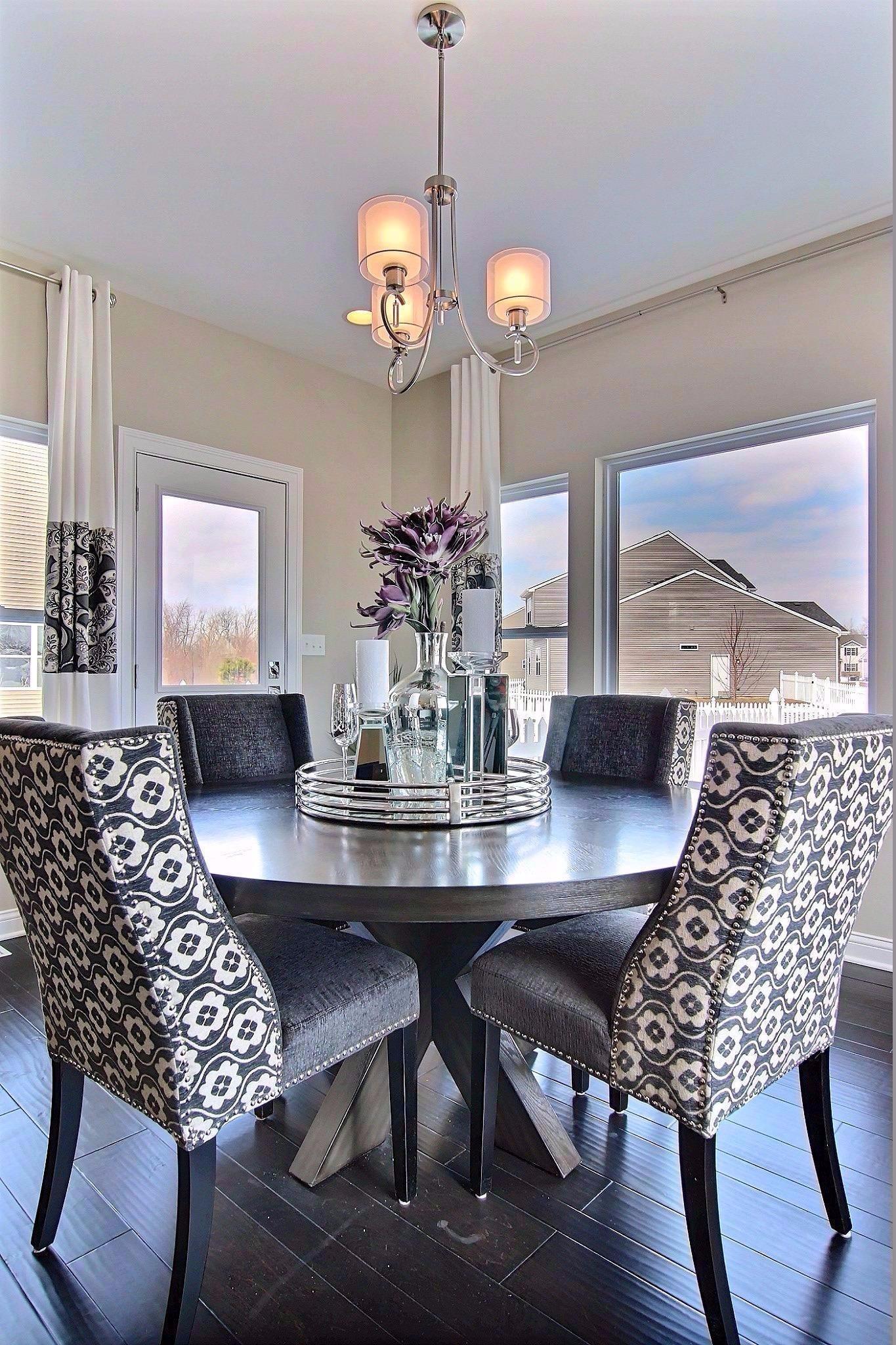 5833 Burr Rdg Circle Crown Point, IN 46307 - Photo 6 of 19 a view of a dining room with furniture and wooden floor