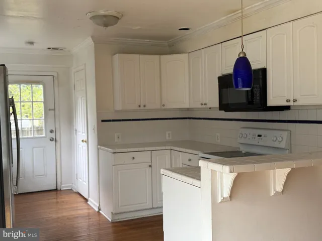 a utility room with cabinets