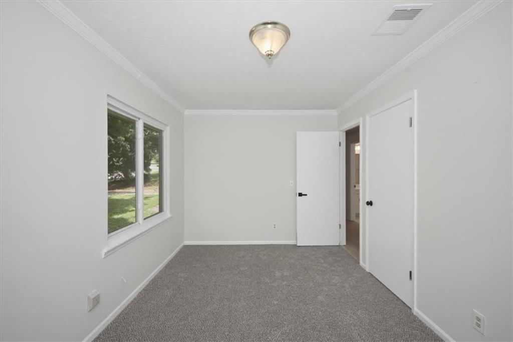 142 Deer Run Canton, GA 30114 - Photo 6 of 24 a view of an empty room with a window