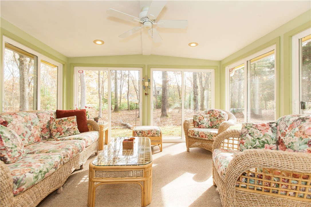 133 Forge Road North Kingstown, RI 02852 - Photo 28 of 35 Three season room with carpeting and ceiling fan.