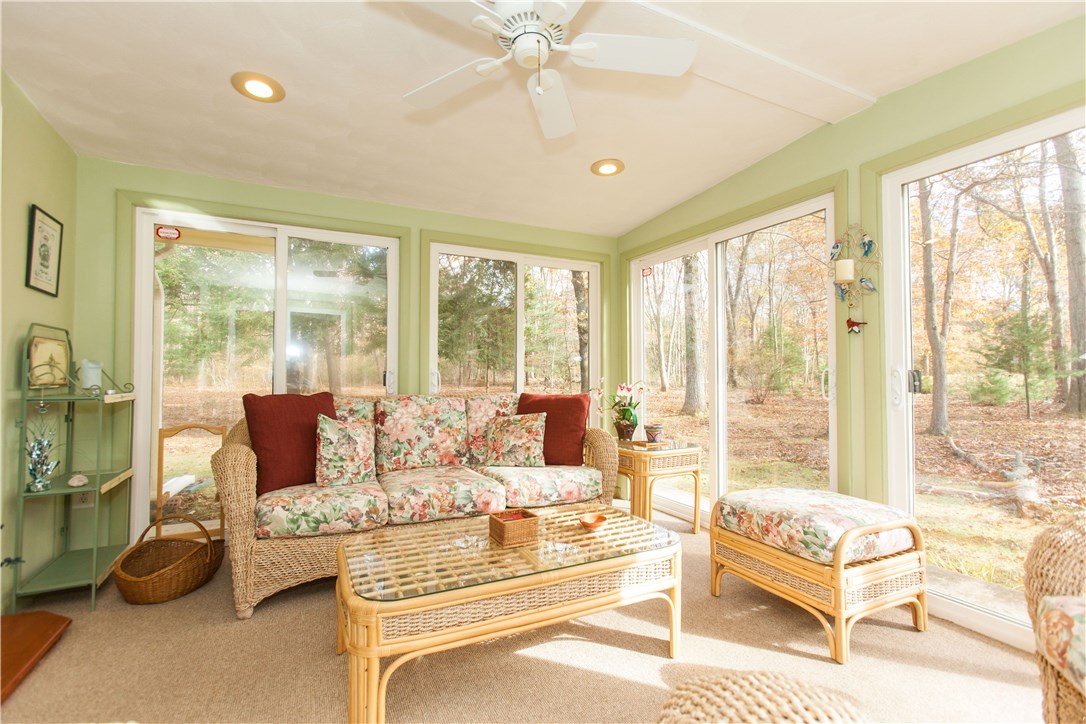 133 Forge Road North Kingstown, RI 02852 - Photo 29 of 35 Three season room with walls of glass and French doors to the living room.