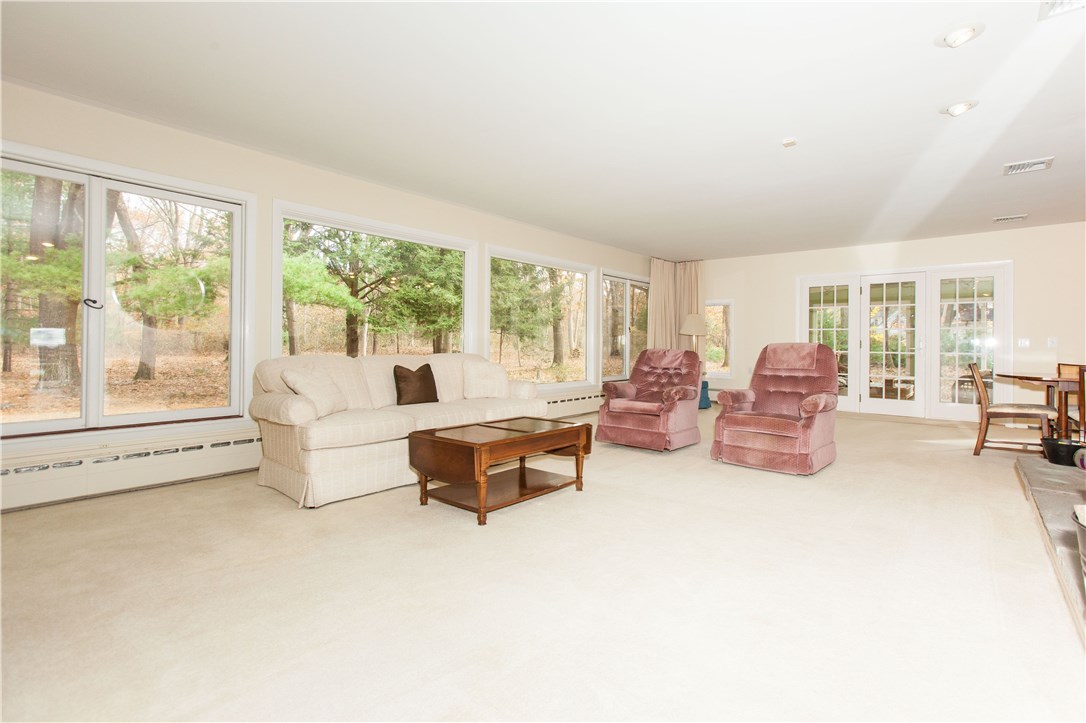 133 Forge Road North Kingstown, RI 02852 - Photo 6 of 35 Living room with wall to wall carpeting and opens to the formal dining room.