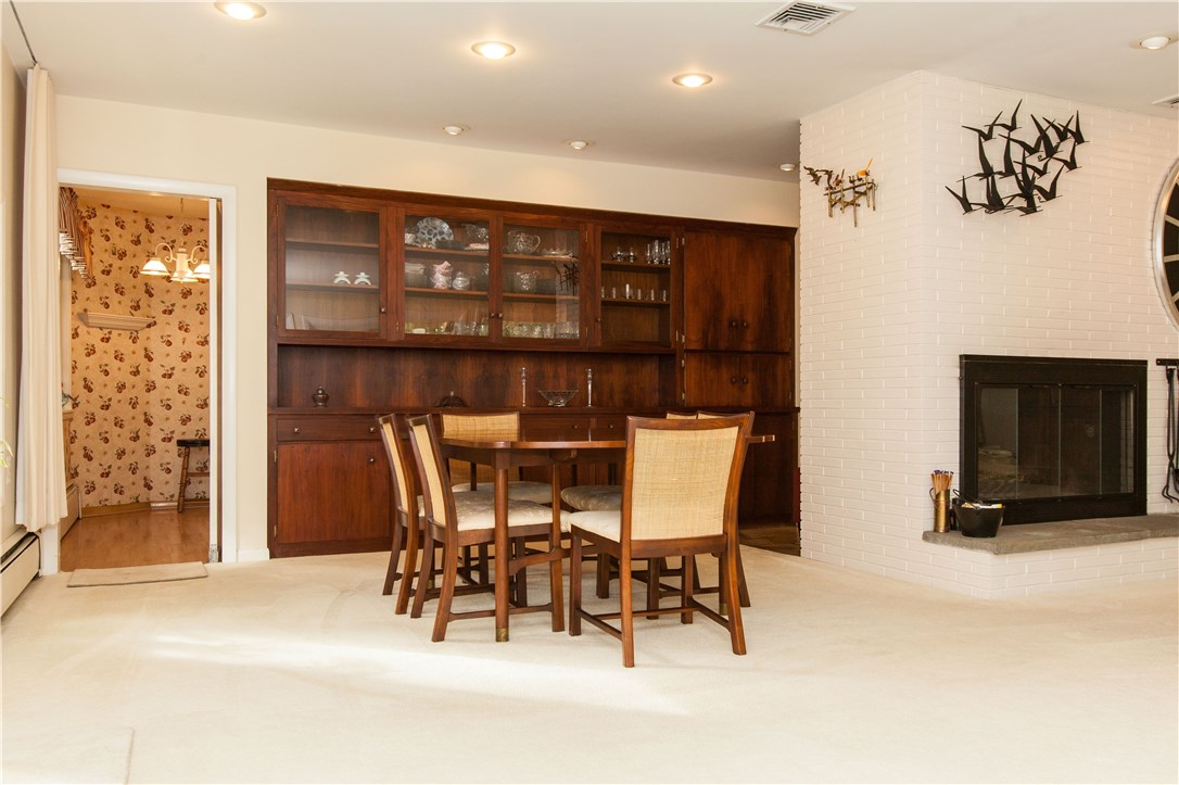 133 Forge Road North Kingstown, RI 02852 - Photo 9 of 35 Formal dining room opens to the living room. Built-in hutch and bar area.