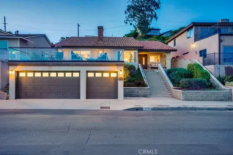 a front view of a house with yard
