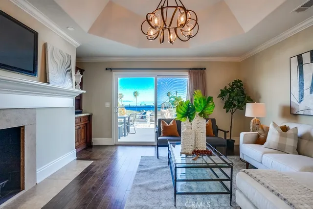 a view of a balcony with chairs and wooden floor