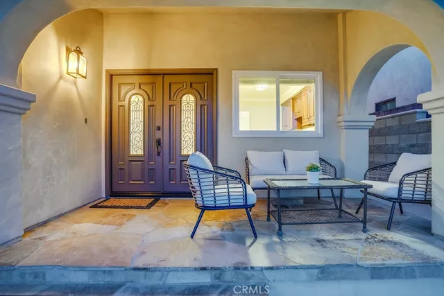 a view of a livingroom with a fireplace cabinet and hallway