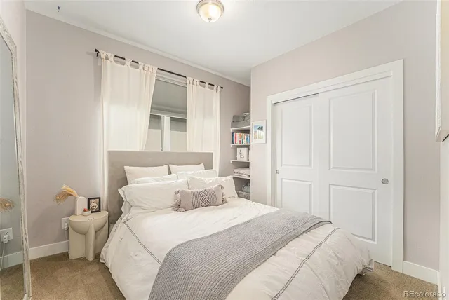 a bathroom with a sink a toilet and shower curtain