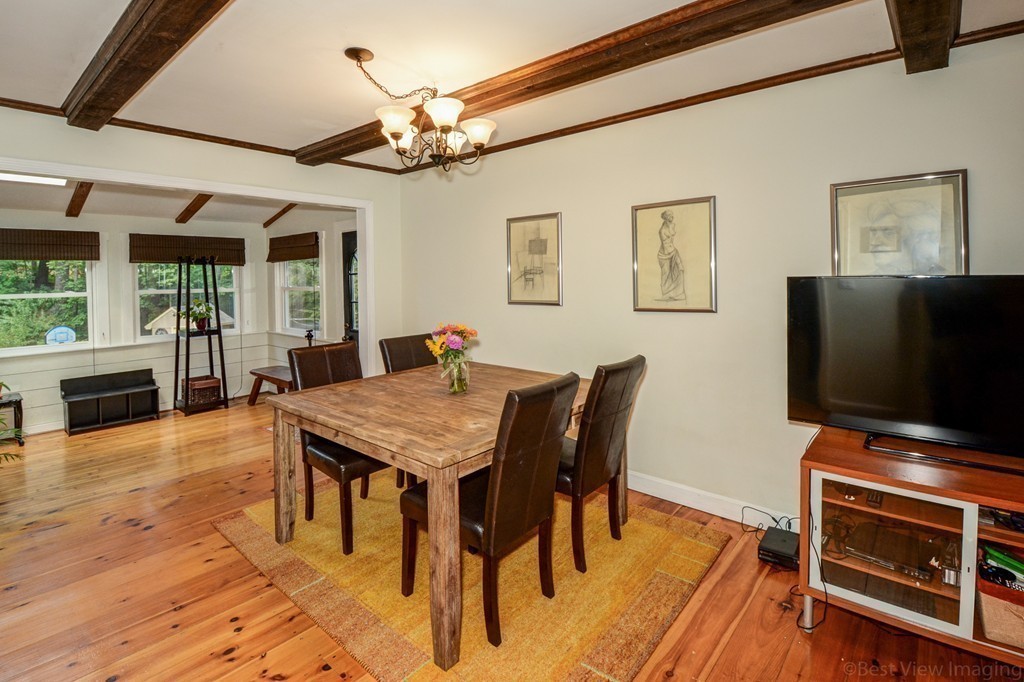 854 Great Road Stow, MA 01775 - Photo 3 of 8 a view of a dining room with furniture and wooden floor