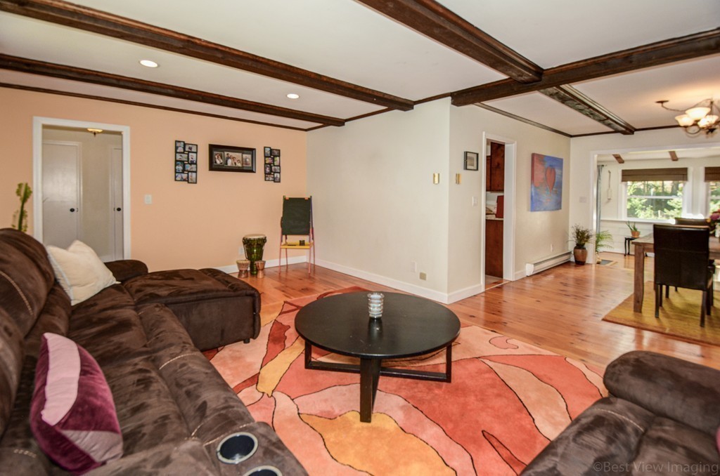 854 Great Road Stow, MA 01775 - Photo 4 of 8 a living room with furniture and a wooden floor