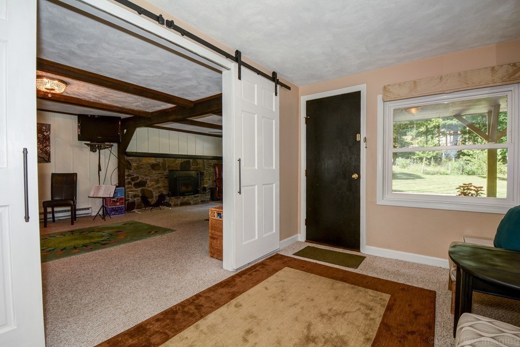 854 Great Road Stow, MA 01775 - Photo 7 of 8 a view of a livingroom with furniture and a livingroom