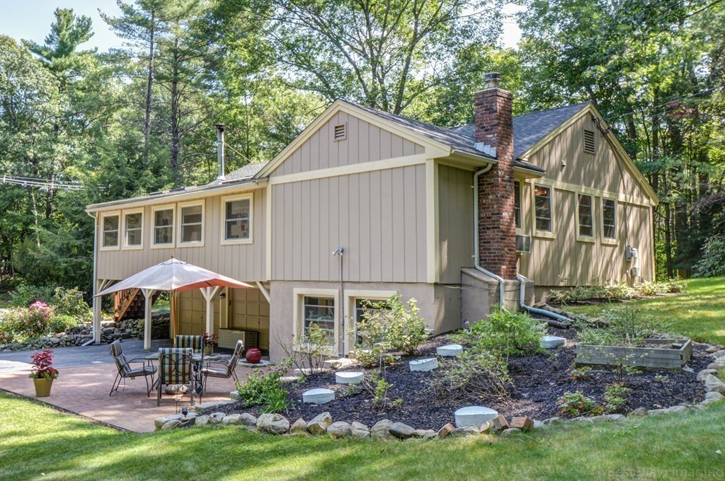 854 Great Road Stow, MA 01775 - Photo 8 of 8 a house that has tree in front of it