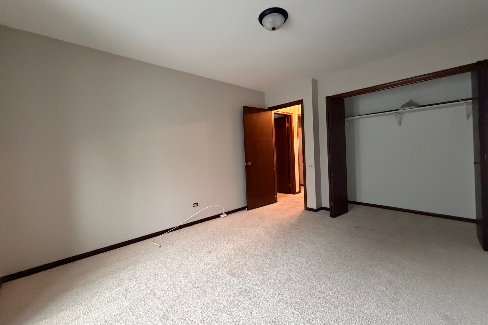 9630 Reding Circle Des Plaines, IL 60016 - Photo 19 of 32 an empty room with closet and a window