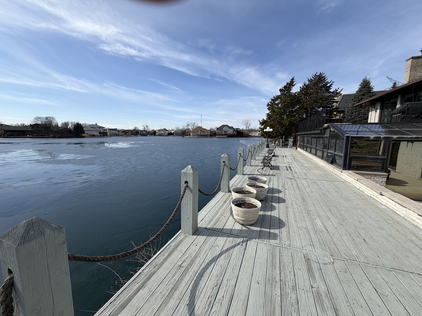 9630 Reding Circle Des Plaines, IL 60016 - Photo 2 of 32 a view of a balcony with chair and wooden floor