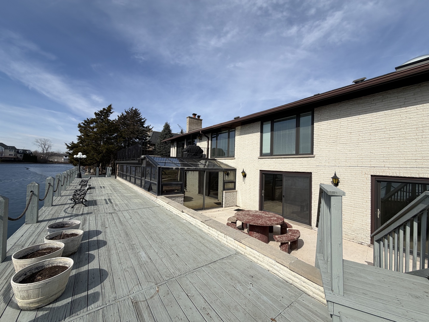 9630 Reding Circle Des Plaines, IL 60016 - Photo 3 of 32 a view of a terrace with chairs and potted plants