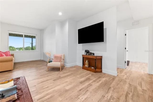 a living room with furniture and a rug