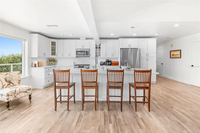 a view of living room with furniture and flat screen tv