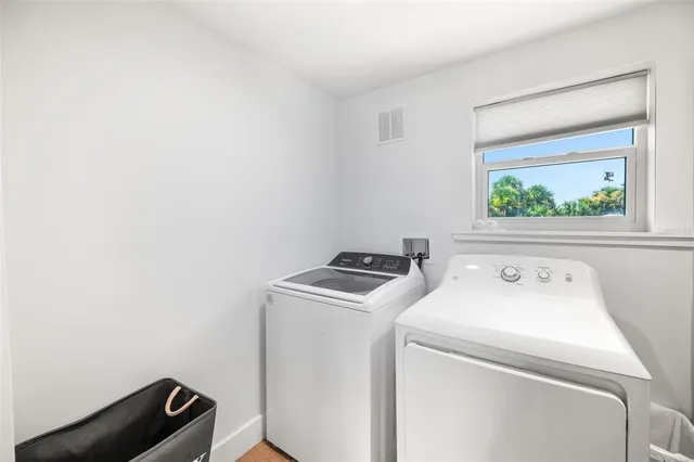 a view of a bathroom with a tub and mirror