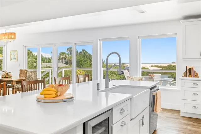 a kitchen with a sink and large window