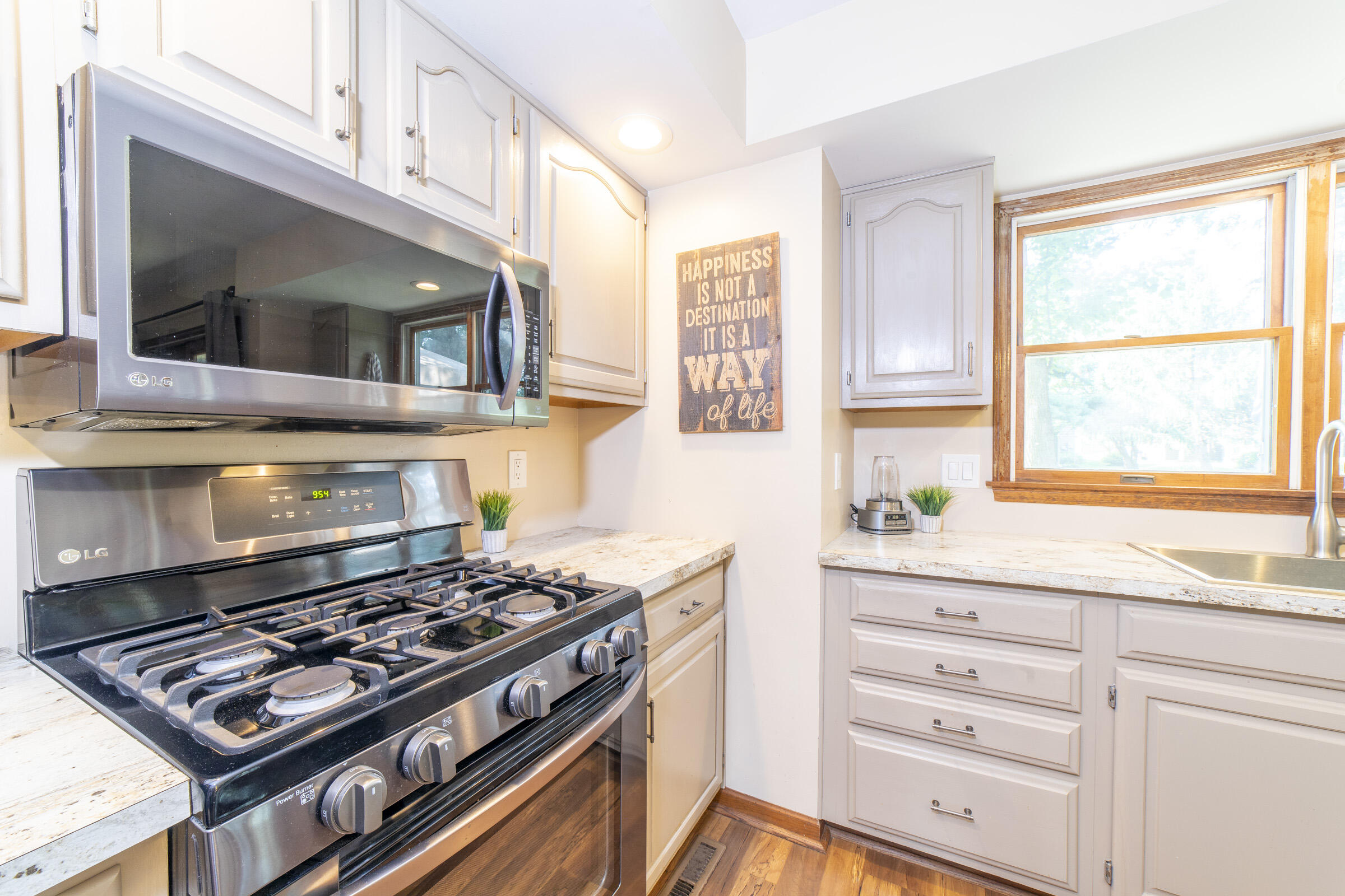 910 Read Drive Chesterton, IN 46304 - Photo 17 of 57 a kitchen with stainless steel appliances a stove and a microwave