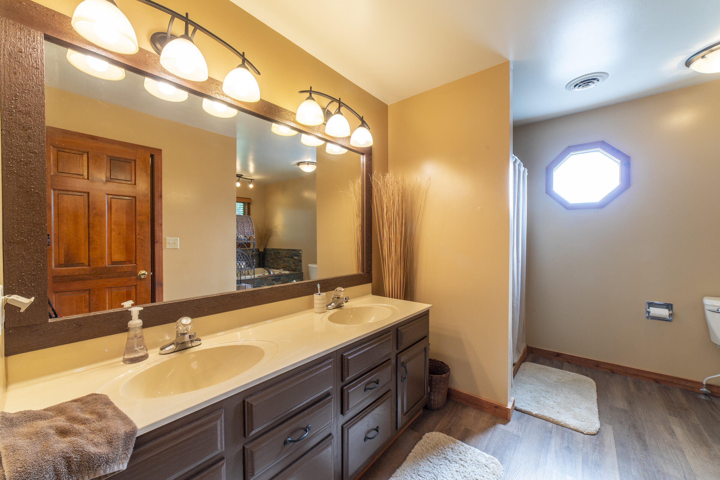 910 Read Drive Chesterton, IN 46304 - Photo 27 of 57 a bathroom with a double vanity sink and a mirror