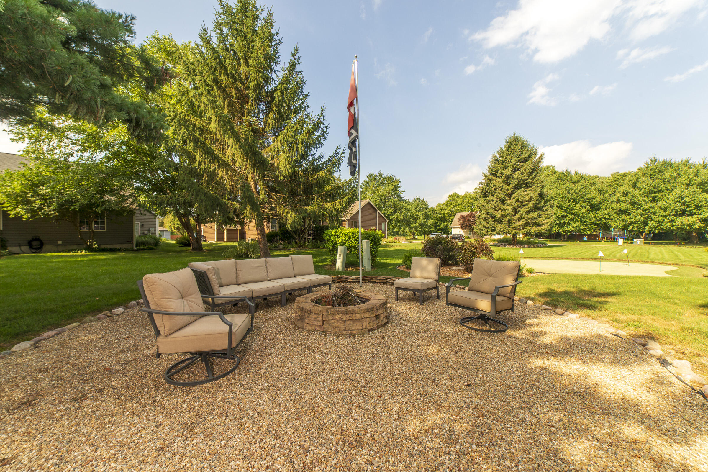 910 Read Drive Chesterton, IN 46304 - Photo 46 of 57 a backyard of a house with table and chairs