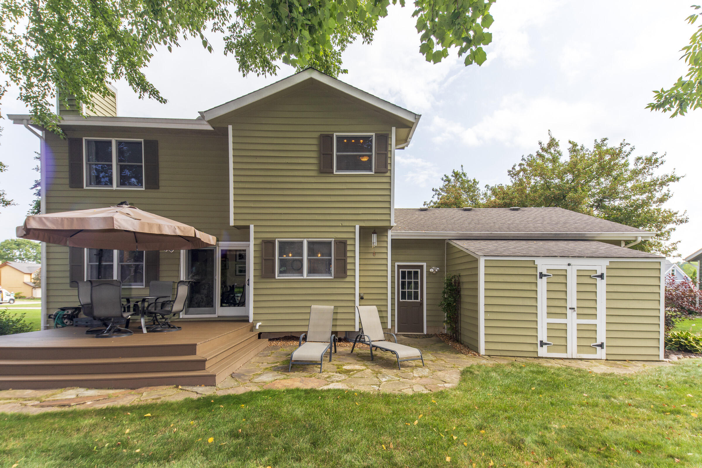 910 Read Drive Chesterton, IN 46304 - Photo 50 of 57 a front view of a house with a yard outdoor seating and barbeque oven