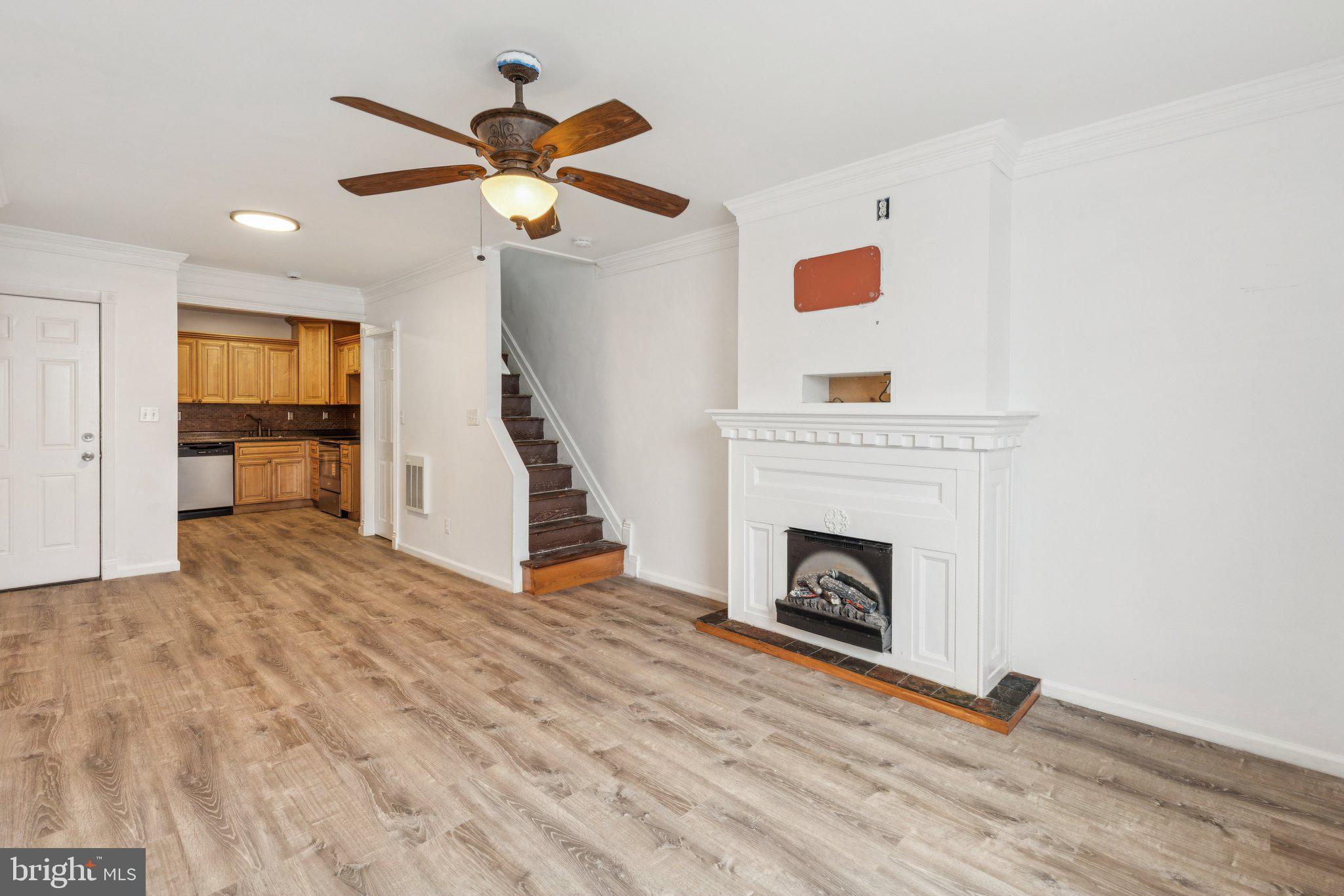 1444 North Perth Street Philadelphia, PA 19122 - Photo 2 of 27 a view of a livingroom with a fireplace and wooden floor