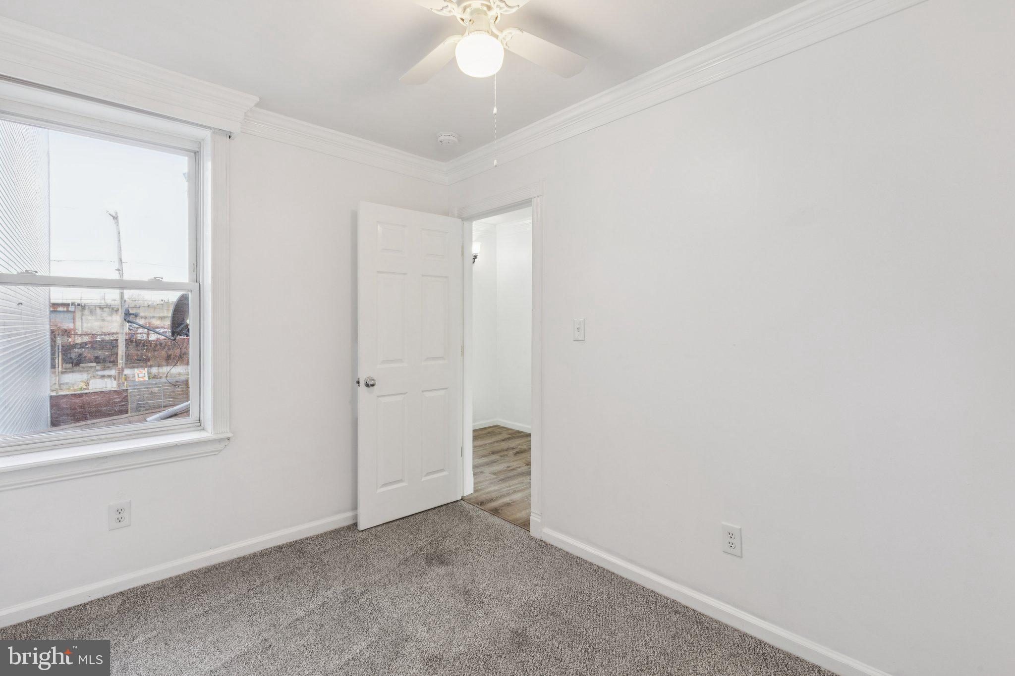 1444 North Perth Street Philadelphia, PA 19122 - Photo 21 of 27 an empty room with a window