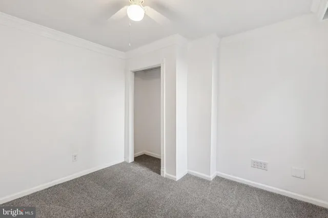 a view of a hallway with stairs