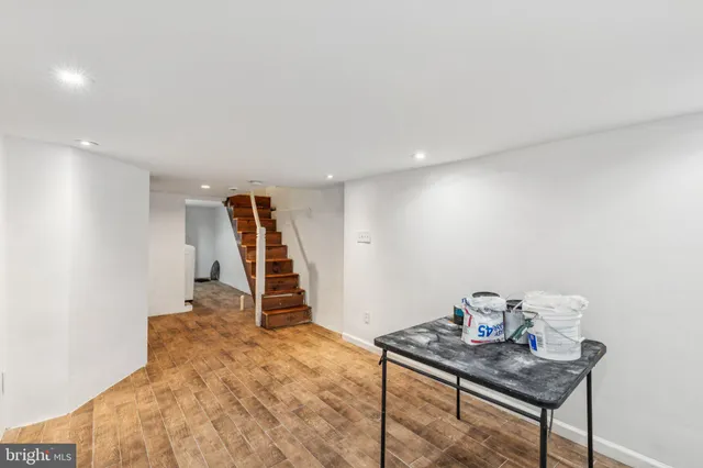 a kitchen with a sink and a stove top oven