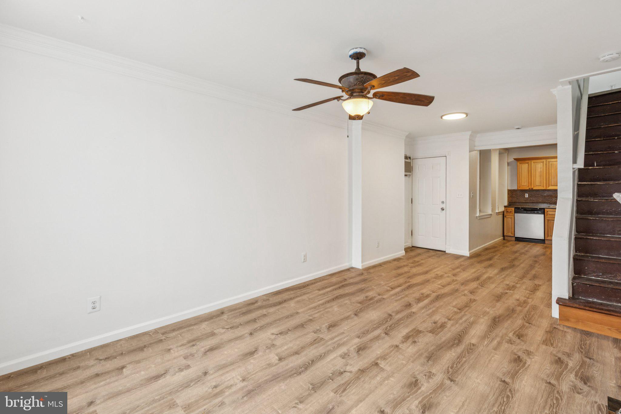 1444 North Perth Street Philadelphia, PA 19122 - Photo 4 of 27 a view of empty room with wooden floor and ceiling fan