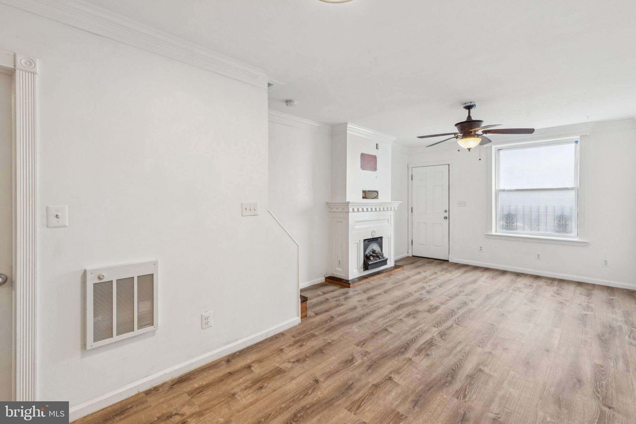 1444 North Perth Street Philadelphia, PA 19122 - Photo 6 of 27 wooden floor in an empty room with a window