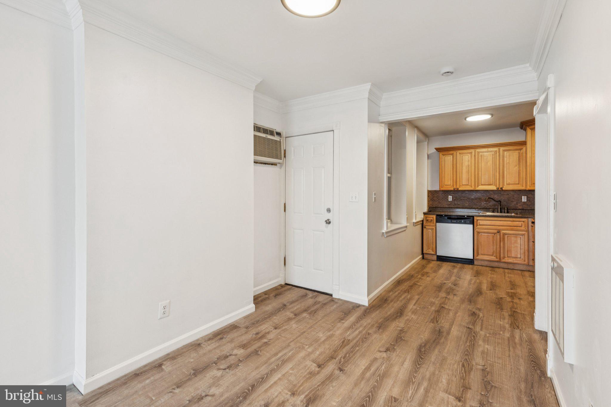 1444 North Perth Street Philadelphia, PA 19122 - Photo 7 of 27 a view of a kitchen with a sink and a refrigerator
