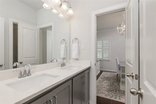a bathroom with a sink double vanity and a mirror