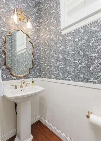 a bathroom with a sink and mirror