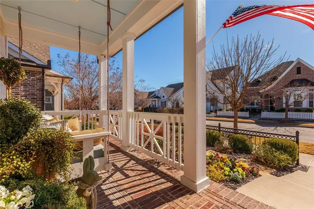 a living room with a bed furniture and a window