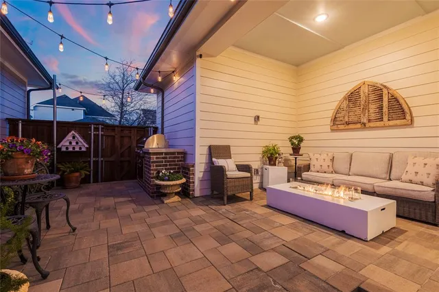 a view of a porch with chairs and backyard
