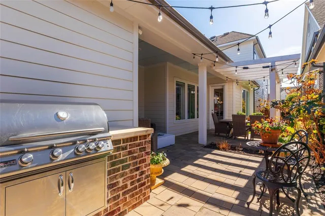 a view of a chairs and a table in a patio