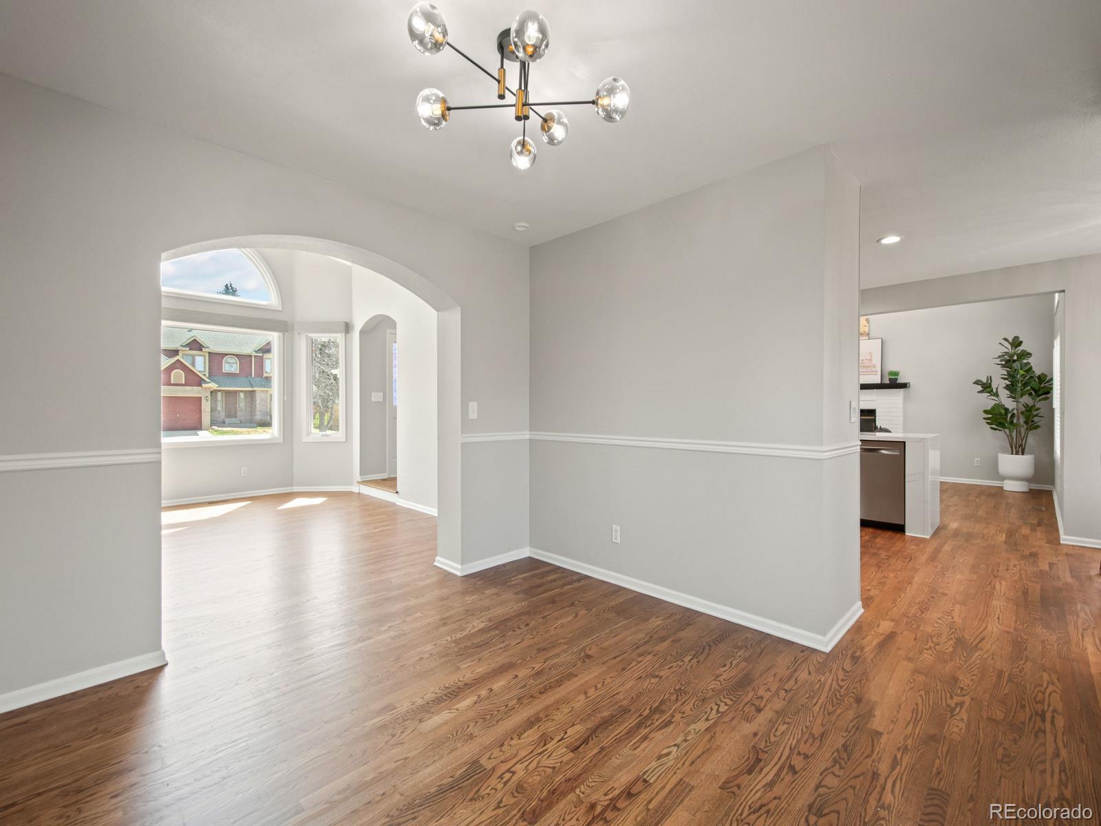 9358 Cornell Circle Highlands Ranch, CO 80130 - Photo 14 of 50 wooden floor in an empty room with a window