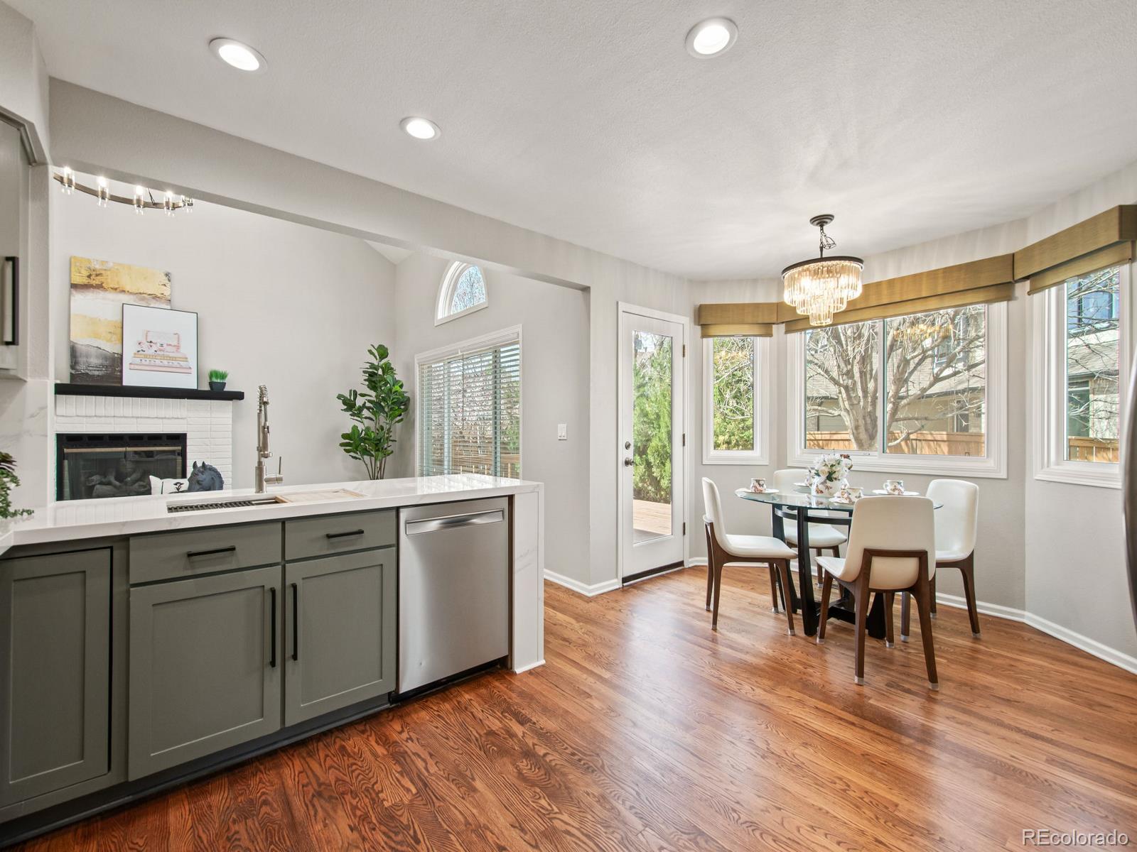 9358 Cornell Circle Highlands Ranch, CO 80130 - Photo 18 of 50 a view of a dining room with furniture window and wooden floor