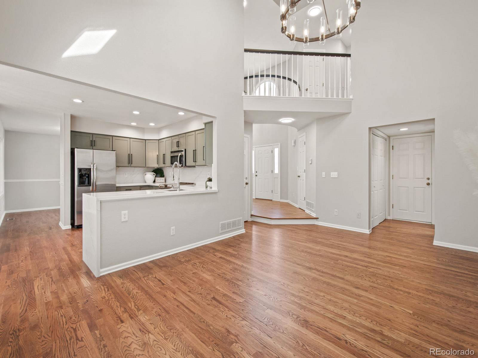 9358 Cornell Circle Highlands Ranch, CO 80130 - Photo 22 of 50 a view of kitchen with cabinets and wooden floor