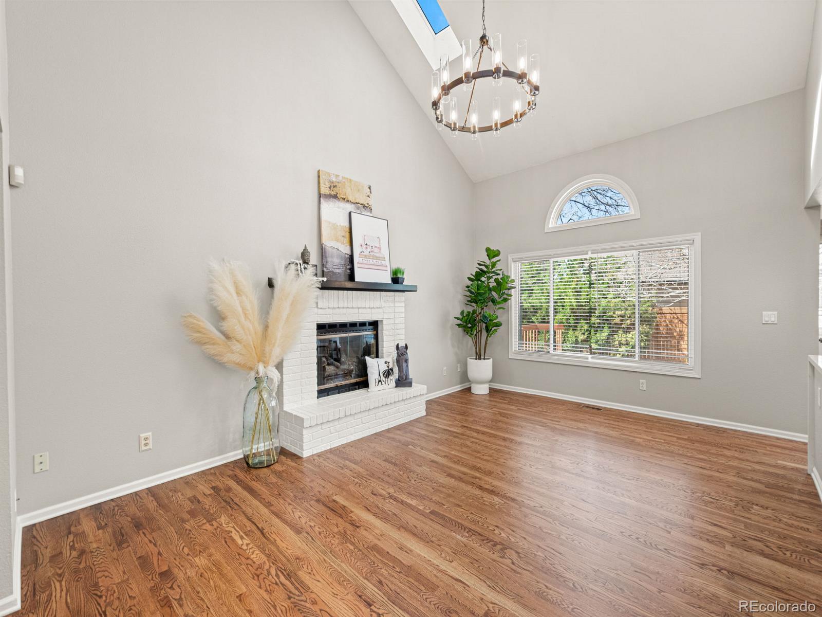 9358 Cornell Circle Highlands Ranch, CO 80130 - Photo 23 of 50 a view of empty room with wooden floor and fan